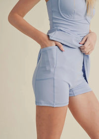 showcasing a soft blue active dress that has a phone pocket on the inside 