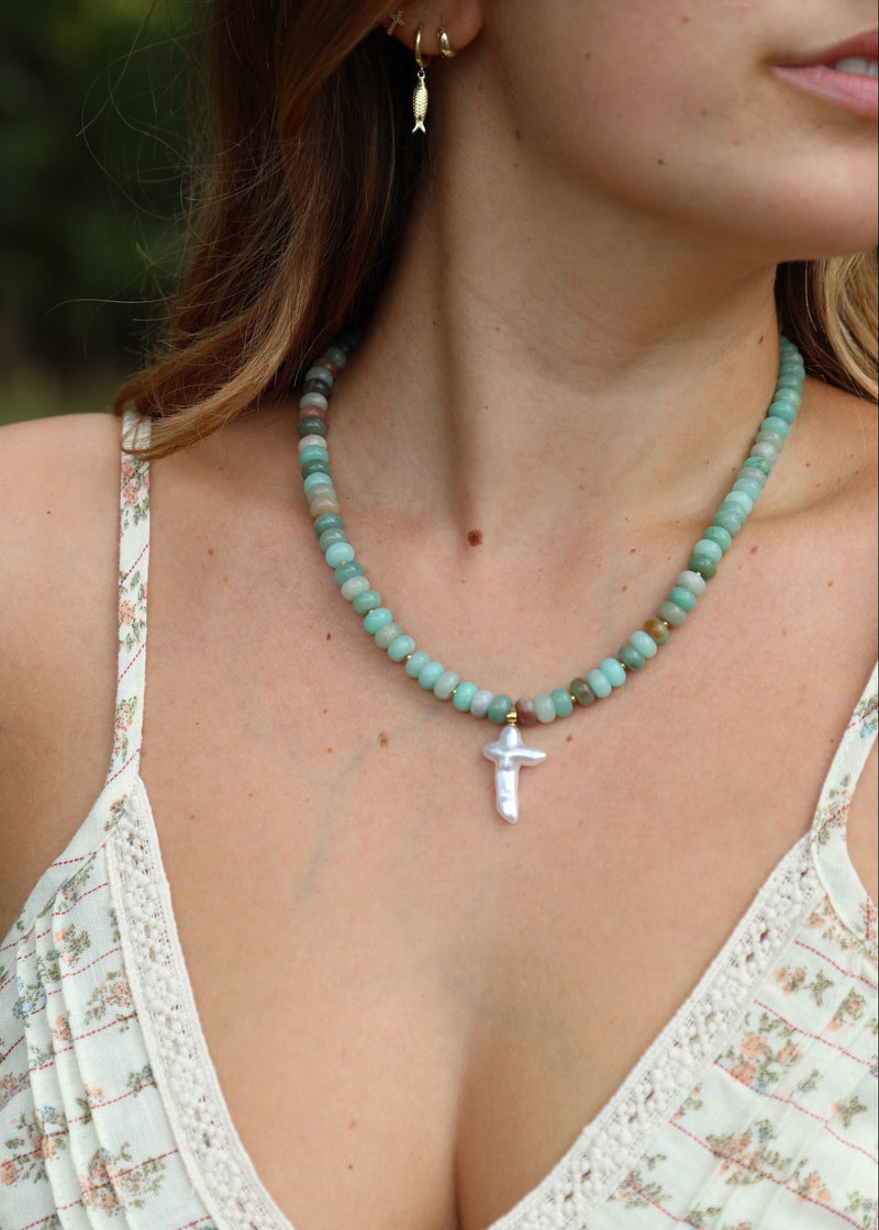 teal beaded necklace with baroque cross pendant