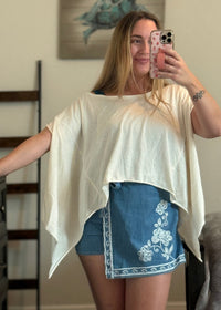 cream flowy top, versatile everyday top for young woman