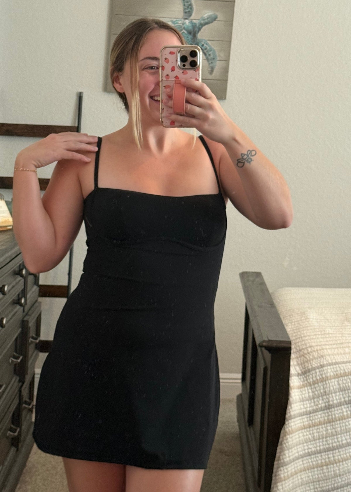 young woman wearing black active dress with pockets, athleisure outfit inspiration